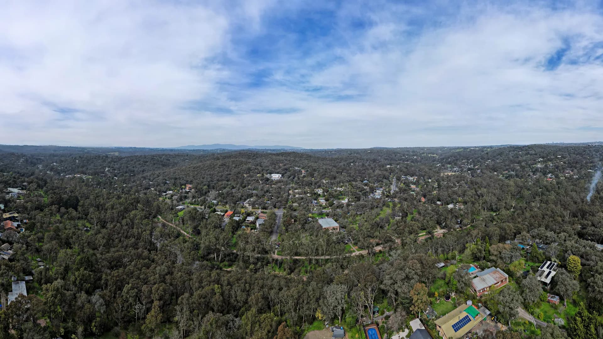 Aerial view of Warrandyte township among trees beside the Yarra